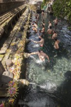 Bathers in Tirta Empul Hot Springs, Bali, Indonesia