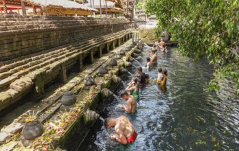 Bathers in Tirta Empul Hot Springs, Bali, Indonesia