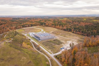 Large industrial area surrounded by autumn forests and vast landscapes, new Lindenrain industrial