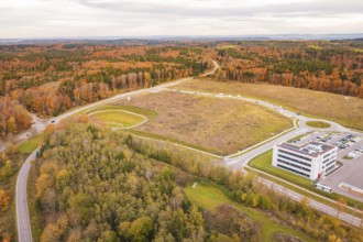 Industrial area surrounded by autumnal forests and spacious landscapes, new Lindenrain industrial