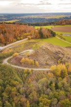 Panoramic view of autumn hills with colorful foliage, new Lindenrain industrial park, Calw, Black