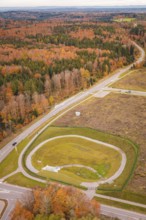 Roundabout surrounded by autumn leaves and extensive countryside, new Lindenrain industrial park,