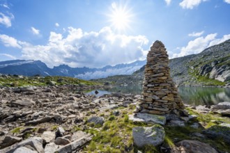 Steinmännchen am See mountain lake, picturesque mountain landscape with dammastock and damma