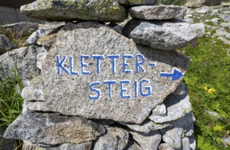 Guide with the inscription via ferrata on rocks, Bergseehütte, Göscheneralp, Canton of Uri,