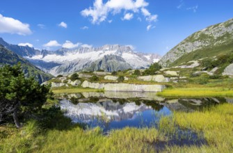 Picturesque mountain landscape, dammastock and damma glaciers reflected in Moorsee, Göscheneralp,
