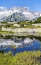 Picturesque mountain landscape, dammastock and damma glaciers reflected in Moorsee, Göscheneralp,