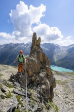 Crocodile rock formation, mountaineer on rope bridge in the Crocodile Mountain Lake via ferrata on