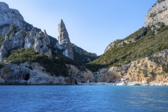 Picturesque rocky coast, cliffs with L'Aguglia pinnacle, blue sea and Cala Goloritzé beach, Golfo