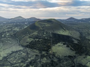 Montaña Negra volcano, picturesque volcanic landscape with volcanic crater at sunrise, Parque