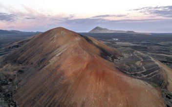 Red volcano Montaña Corujo, picturesque volcanic landscape with volcanic craters at sunrise, Parque