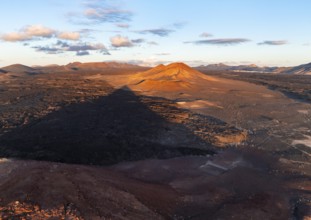 Picturesque volcanic landscape in evening light, Montaña Bermeja volcano between lava fields,