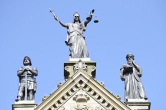 The figures Power, Justice and Wisdom on the town hall in Odense, Fyn, Funen island, Denmark,