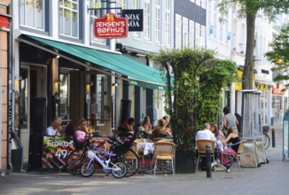 People in street restaurant in Odense, Fyn island, Funen, Denmark, Scandinavia