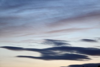 Pastel-coloured cloud formations in the evening sky, Peenetal nature park Park, Mecklenburg-Western