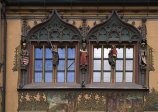 Painted façade with 5 medieval human sculptures, fresco cycle, window, town hall, old town, Ulm,