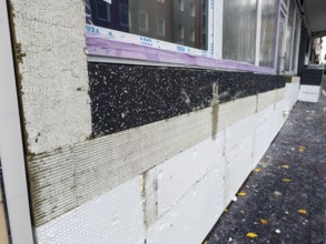 A façade is being renovated with insulation boards and new windows, Wuppertal, Germany