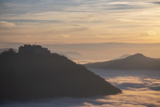 Sunset over the sea of fog from Beurener Fels to Hohenneuffen Castle, Swabian Alb,