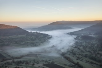 View of the foggy Neidlinger Valley in autumn at sunrise, Swabian Alb
