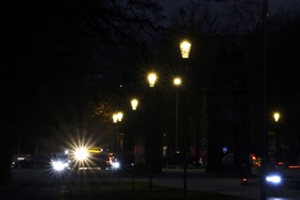 Street at night with lights in a city, November, Germany