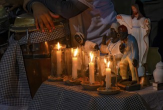 Altar with saints and Umbanda entities in the streets of Belo Horizonte, Minas Gerais, lit with