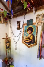 Religious objects inside a simple and rustic house in the interior of Minas Gerais, Brazil with