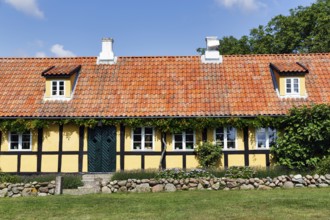 Traditional yellow timber-frame house in Nyker village, Bornholm, Denmark