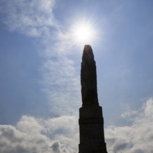 Memorial stone, stone obelisk, Hammershus fortress, tourist attraction, back light, sunbeams,