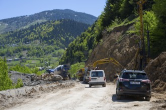 Road construction in mountainous area surrounded by forest and nature, road construction on the way