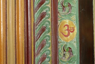 Painted wood carving, Om sign, Kalari Kovilakom, Ayurveda Palace of the Cgh-Earth Hotel Group,