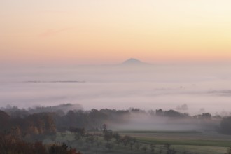 Hohenstaufen in the golden morning light, Aichelberg. Spectacular dawn over the foggy foothills of