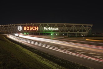 Night view of the A8 with traces of light at the P20 Messe car park, Airport, Stuttgart Germany