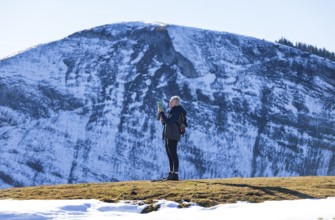 Female hiker on the Trattberg Alm with a view of the Trattberg, Osterhorn Group, Salzkammergut,