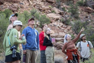 Loma, Colorado - A group of hikers pauses to study rock formations in Ruby Canyon. They were on a