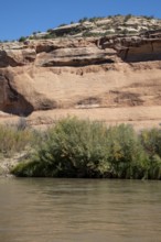 Loma, Colorado - Letters carved into the rock above the Colorado River mark the boundary between