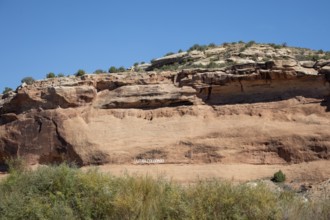 Loma, Colorado - Letters carved into the rock above the Colorado River mark the boundary between