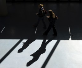 Foyer in a building of the Technical University of Berlin, light and shadow from people at the
