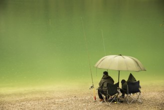 Two anglers, rainy weather, Plansee, Tyrol, Austria