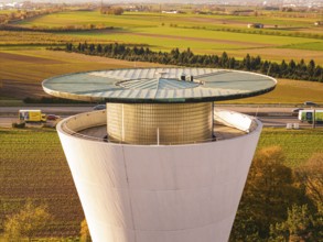 Close-up of a water tower surrounded by fields in an autumn setting, Möglingen water tower, Germany