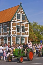 Bulldog, tractor, parade, typical half-timbered house, town hall, architecture, blossom festival,