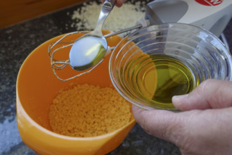 Southern German cuisine, preparing aioli, garlic cream, mayonnaise, oil and minced egg, men's