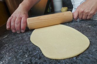 Swabian cuisine, preparing strudel dough, raw potato dough, rolling pin, countertop, baking, out of
