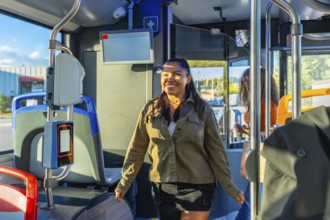 Woman smiling and walking inside a modern city bus, preparing for her daily commute, representing