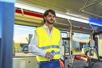 Man wearing an unbuttoned white shirt, blue jeans, and a yellow reflective safety vest, holding a