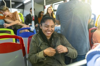 Young woman with closed eyes expressing joy and contentment while traveling on public
