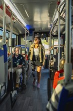 Young woman with a prosthetic leg confidently walking down the aisle of a public bus, representing