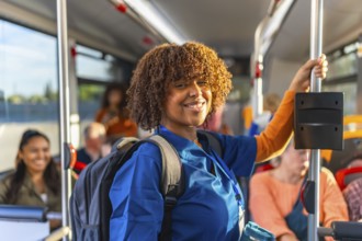 African american woman healthcare worker in blue scrubs carrying a backpack and smiling while