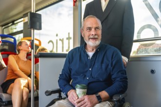 Senior man with a disability using his wheelchair for accessible urban mobility, commuting