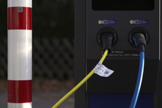Detailed view, parking lot with gas pump, EnBW charging station for electric cars, charging