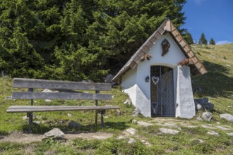 Bench next to a chapel, Brauneck, Bavarian Prealps, Isarwinkel, Lenggries, Upper Bavaria, Bavaria,