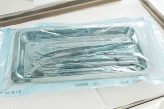 Sterile medical instruments, lying on a tray in protective packaging, dentist's instruments,